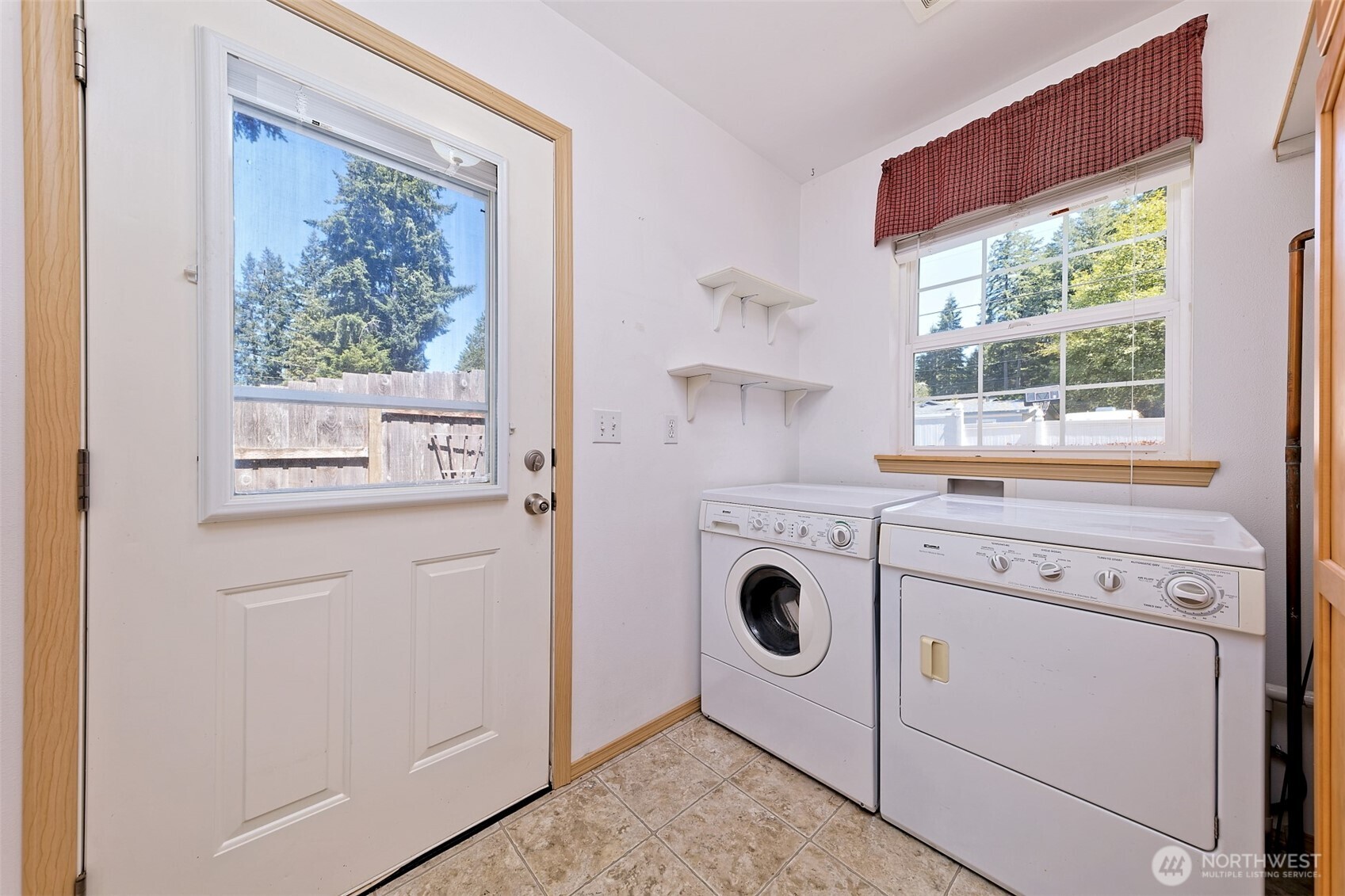 1091 E Trail Belfair, WA 98528 - Photo 25 of 31 a utility room with dryer and washer