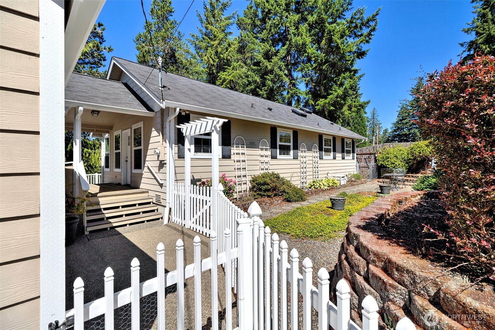 1091 E Trail Belfair, WA 98528 - Photo 3 of 31 a view of a house with a yard