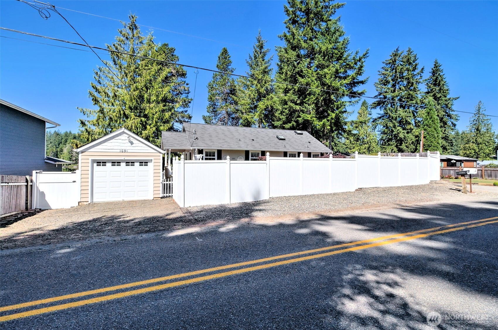 1091 E Trail Belfair, WA 98528 - Photo 5 of 31 a view of a house with a yard