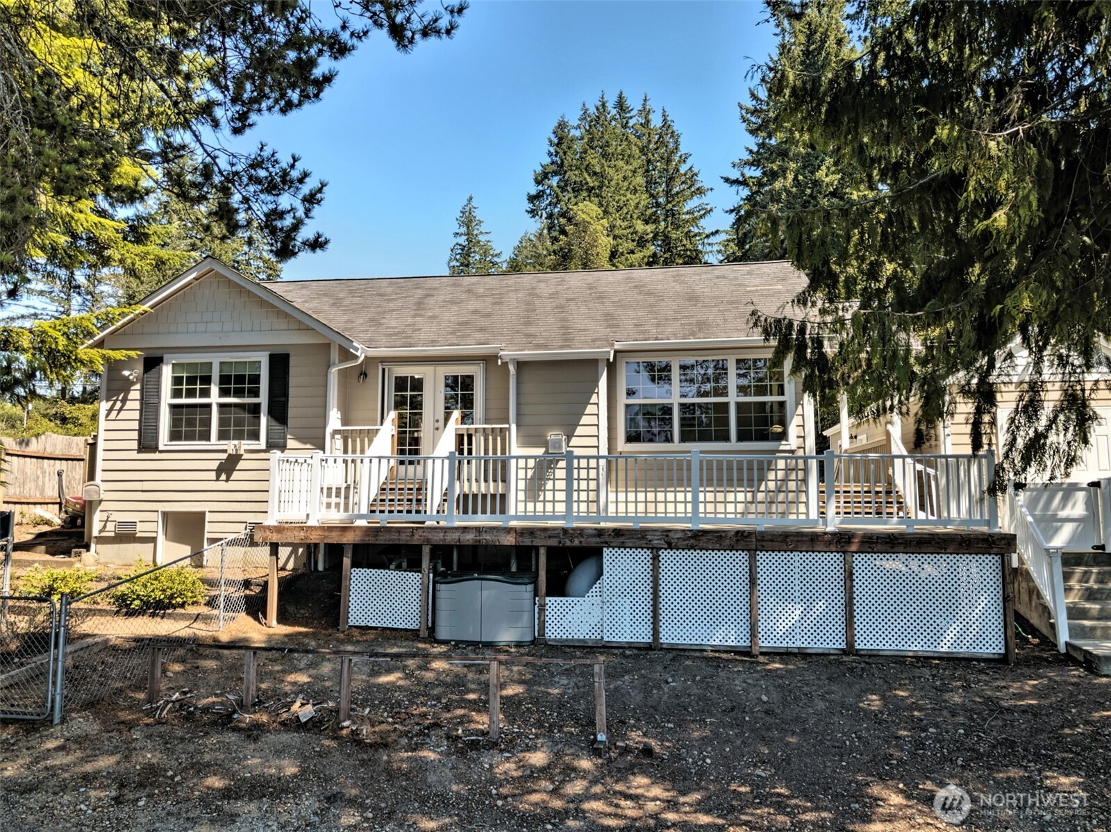 1091 E Trail Belfair, WA 98528 - Photo 9 of 31 a front view of a house with a porch