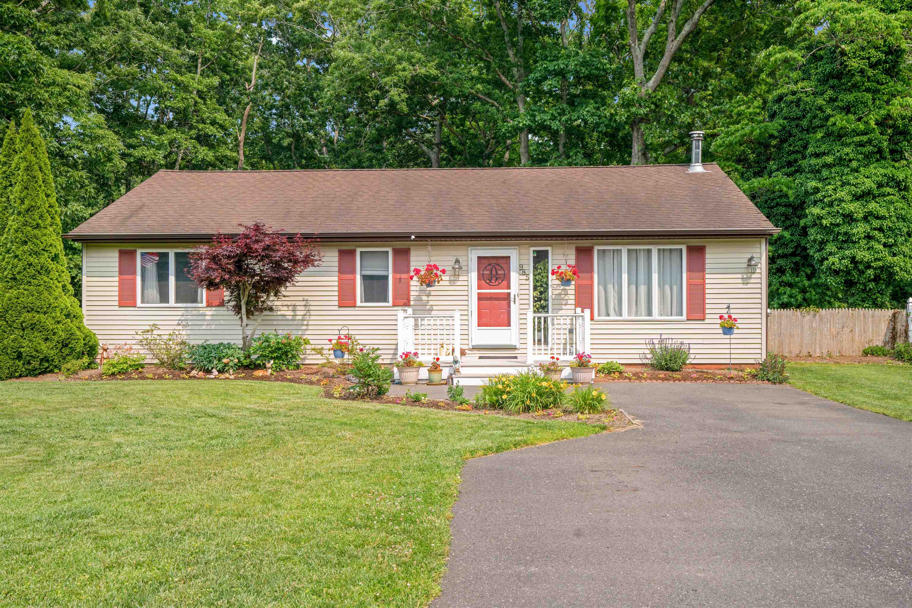 985 Tecumseh Road Erma, NJ 08204 - Photo 4 of 29 a front view of a house with a yard and garage