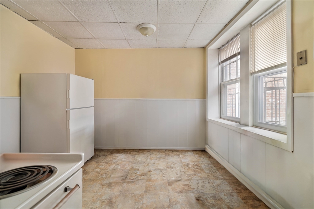99 Prince Street, Unit 6 Boston, MA 02113 - Photo 3 of 14 a view of a kitchen with a stove top oven