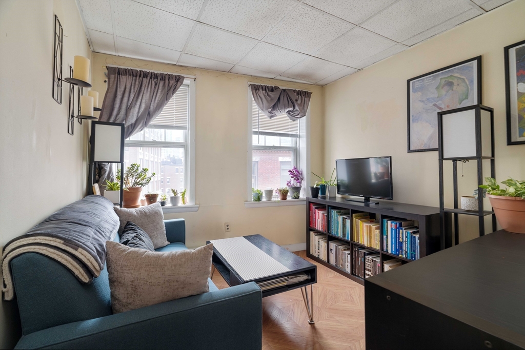 99 Prince Street, Unit 6 Boston, MA 02113 - Photo 6 of 14 a living room with furniture and a flat screen tv