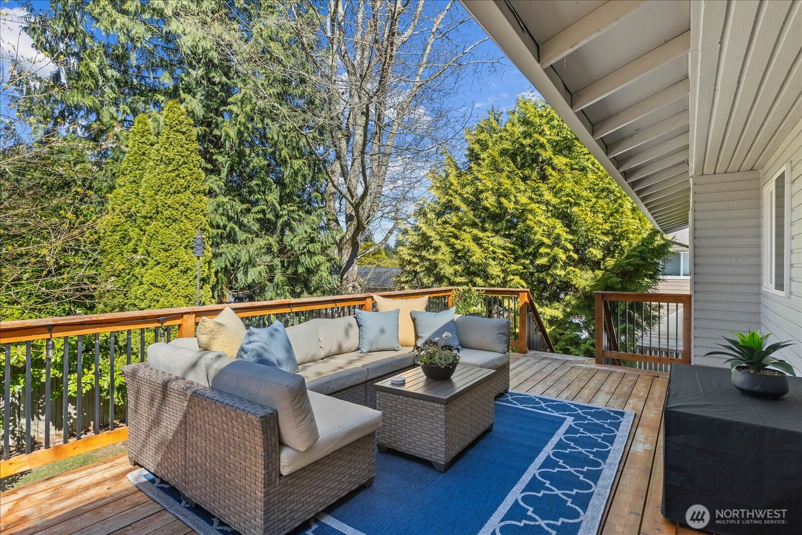 4629 128th Place Southeast Everett, WA 98208 - Photo 13 of 39 a balcony with wooden floor and outdoor seating