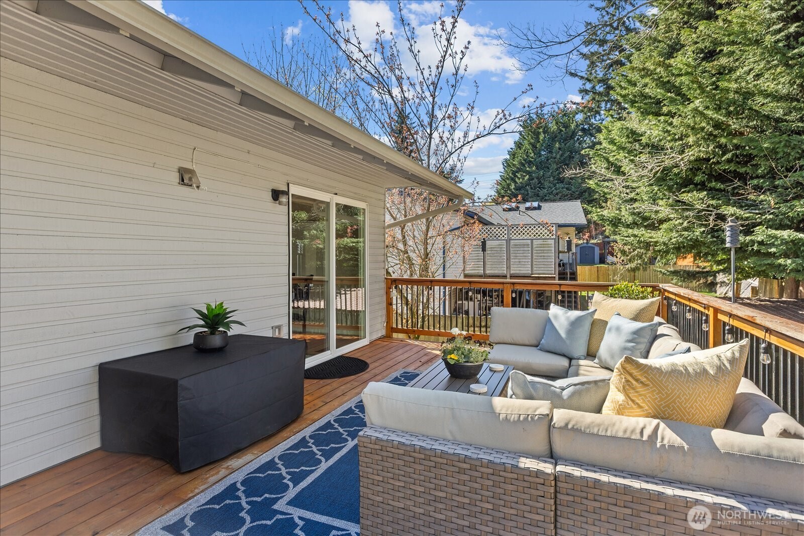4629 128th Place Southeast Everett, WA 98208 - Photo 14 of 39 a view of a patio with couches chairs and wooden floor
