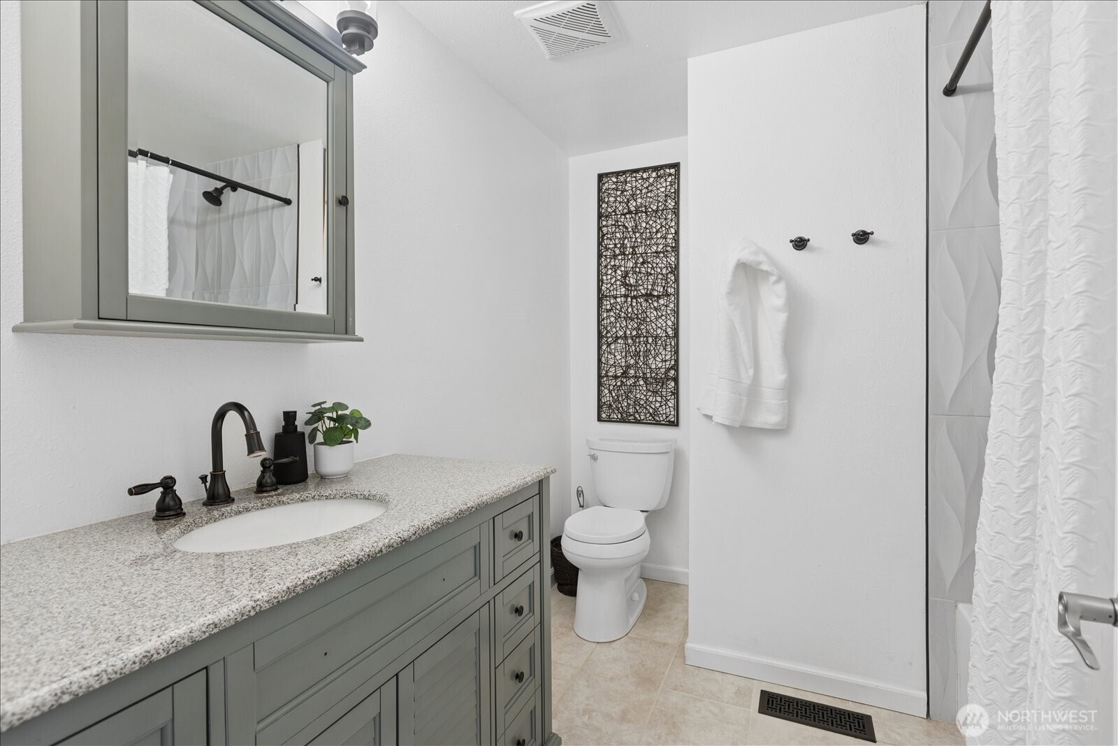 4629 128th Place Southeast Everett, WA 98208 - Photo 22 of 39 a bathroom with a granite countertop sink toilet and mirror