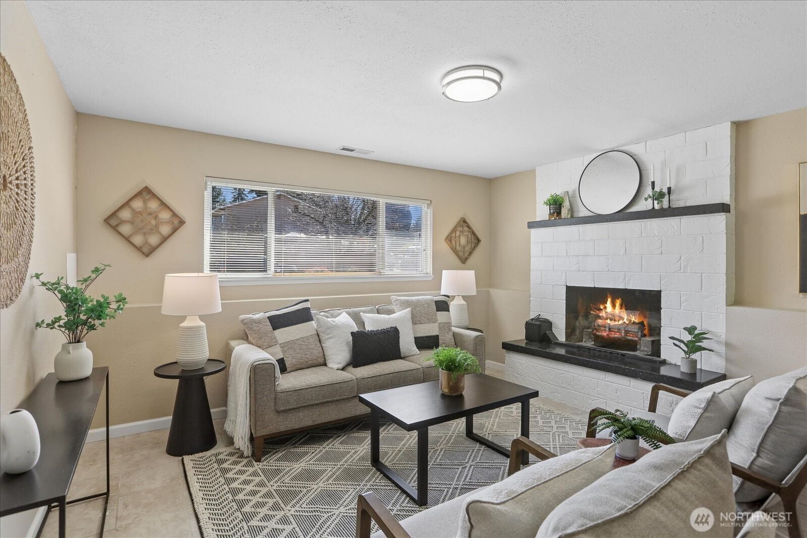 4629 128th Place Southeast Everett, WA 98208 - Photo 24 of 39 a living room with furniture a window and a fireplace