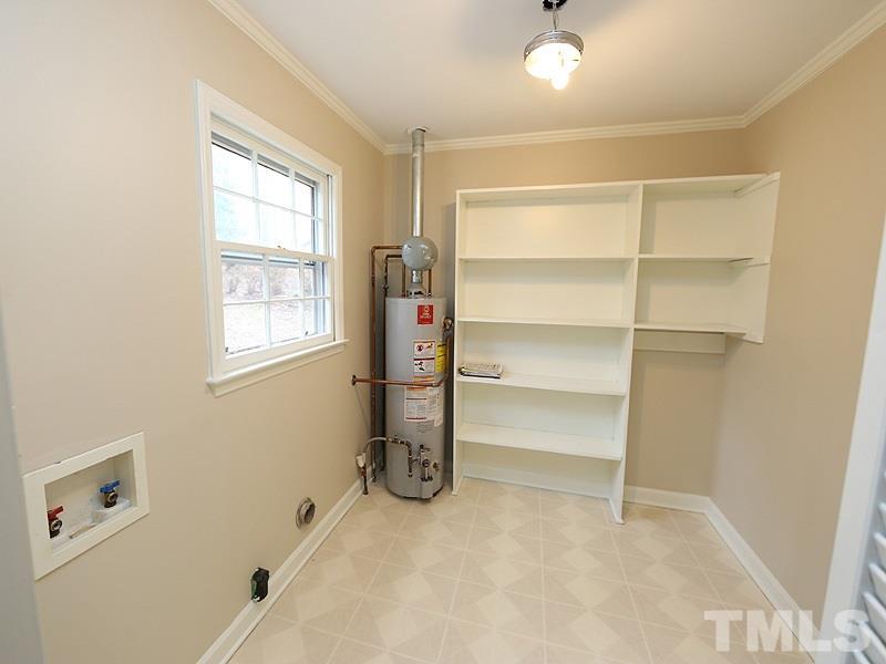 3412 Noel Court Raleigh, NC 27607 - Photo 16 of 25 a room with a closet and a window
