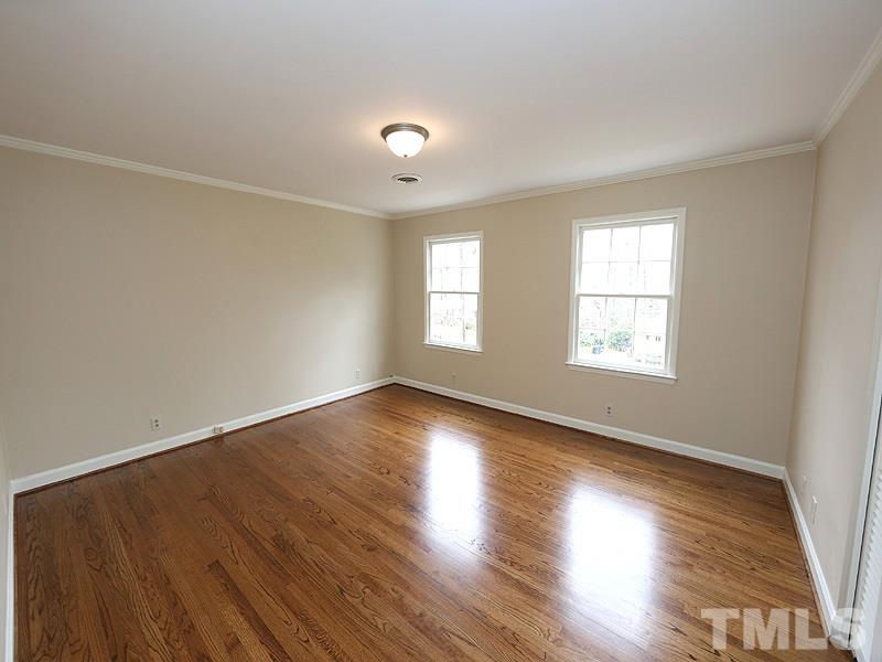 3412 Noel Court Raleigh, NC 27607 - Photo 20 of 25 an empty room with wooden floor and window