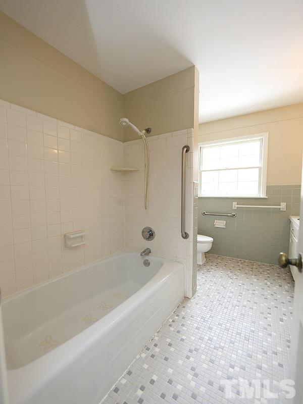 3412 Noel Court Raleigh, NC 27607 - Photo 22 of 25 a bathroom with a bathtub and a shower