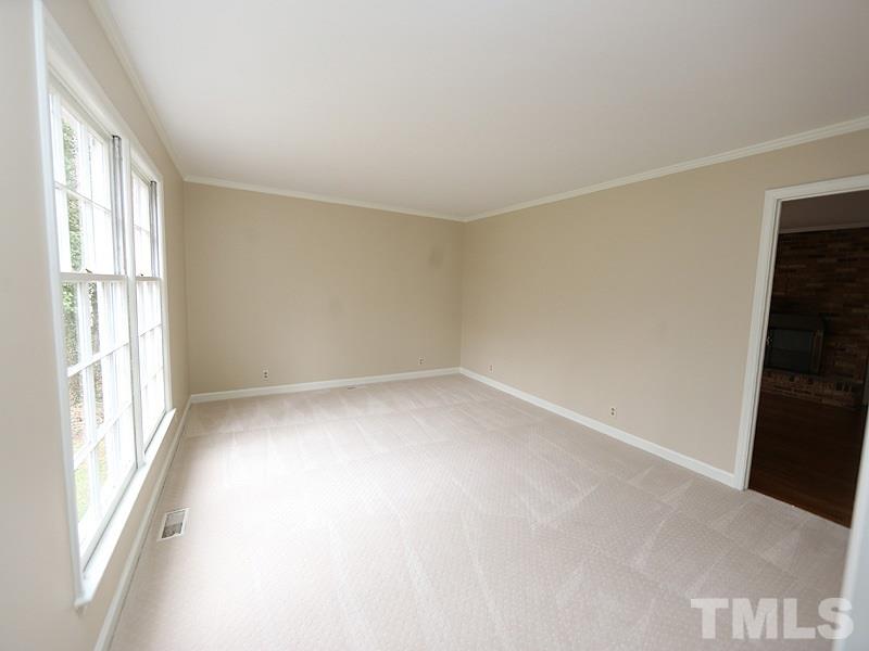 3412 Noel Court Raleigh, NC 27607 - Photo 5 of 25 an empty room with a window
