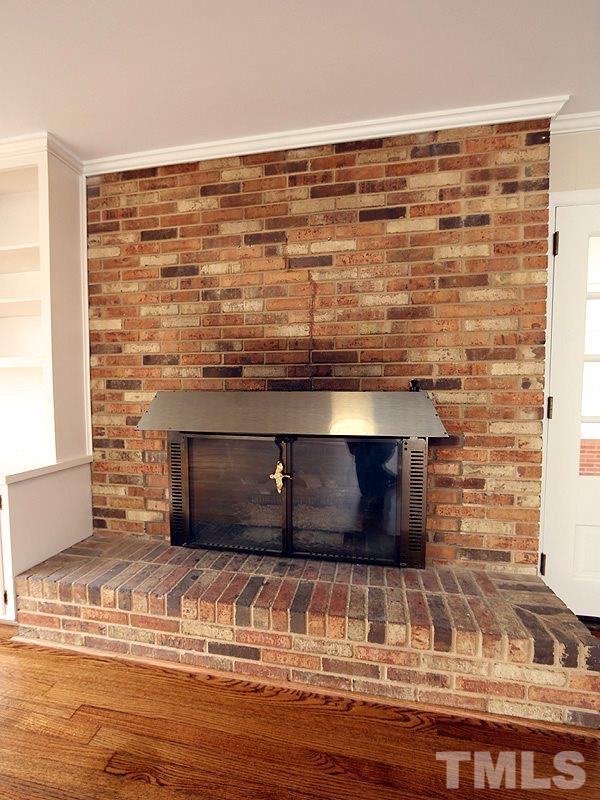 3412 Noel Court Raleigh, NC 27607 - Photo 8 of 25 a room with a fireplace