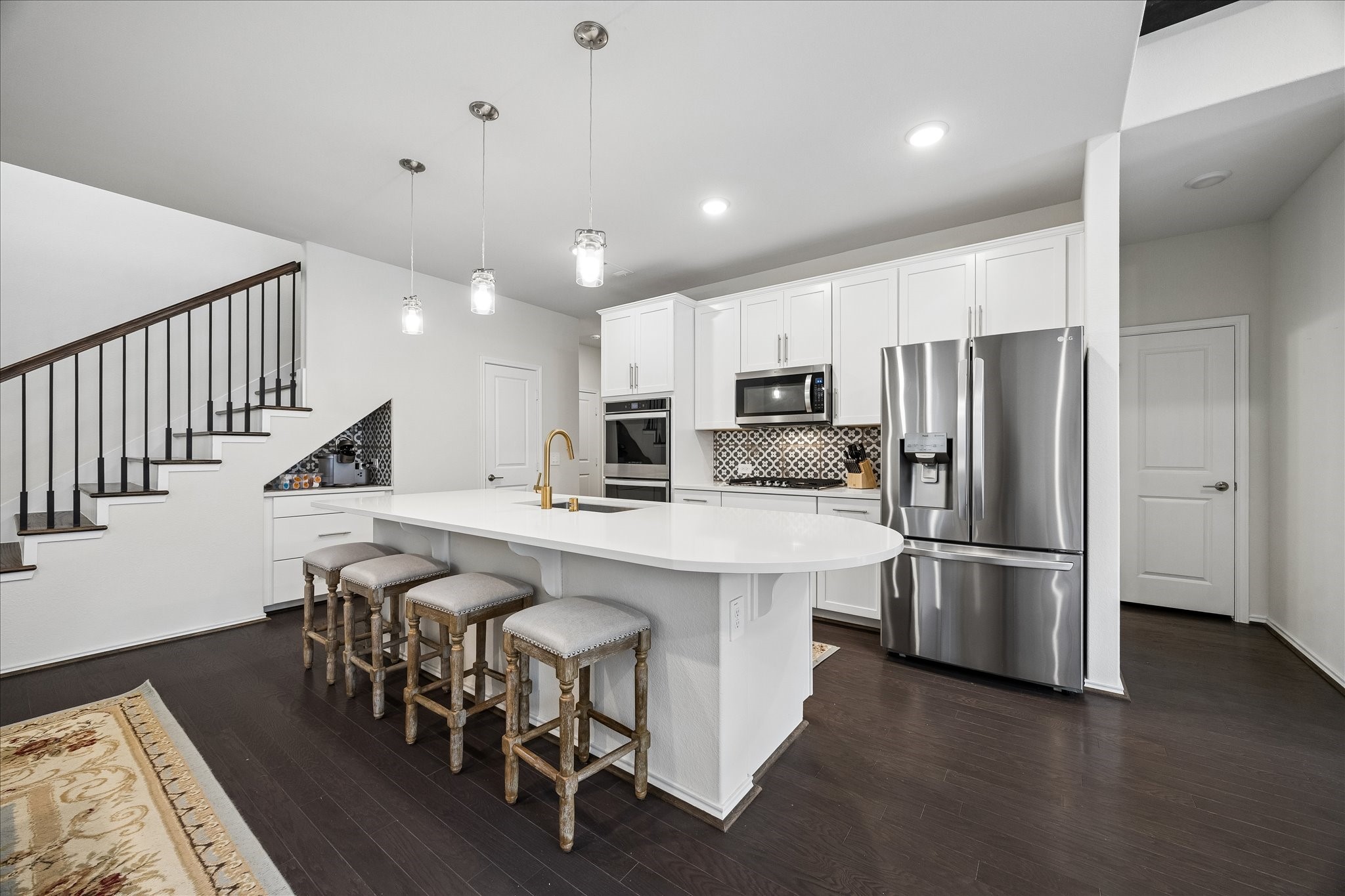 4026 Delta Rose Street Houston, TX 77018 - Photo 11 of 44 Kitchen with oversized island and seating positioned for easy flow to adjacent living and dining areas.