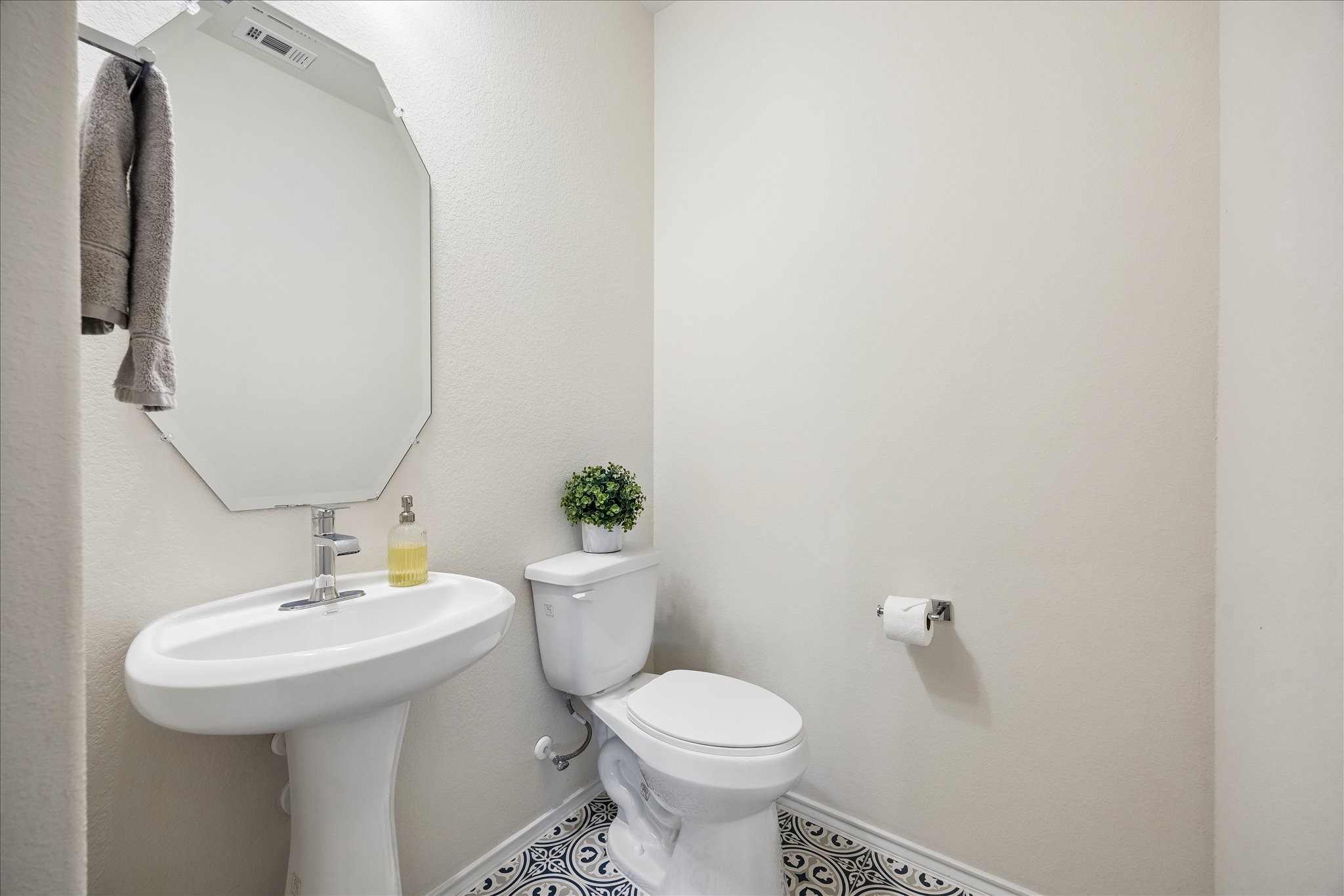 4026 Delta Rose Street Houston, TX 77018 - Photo 23 of 44 Convenient half bath with pedestal sink and tile floors ideal for guests.