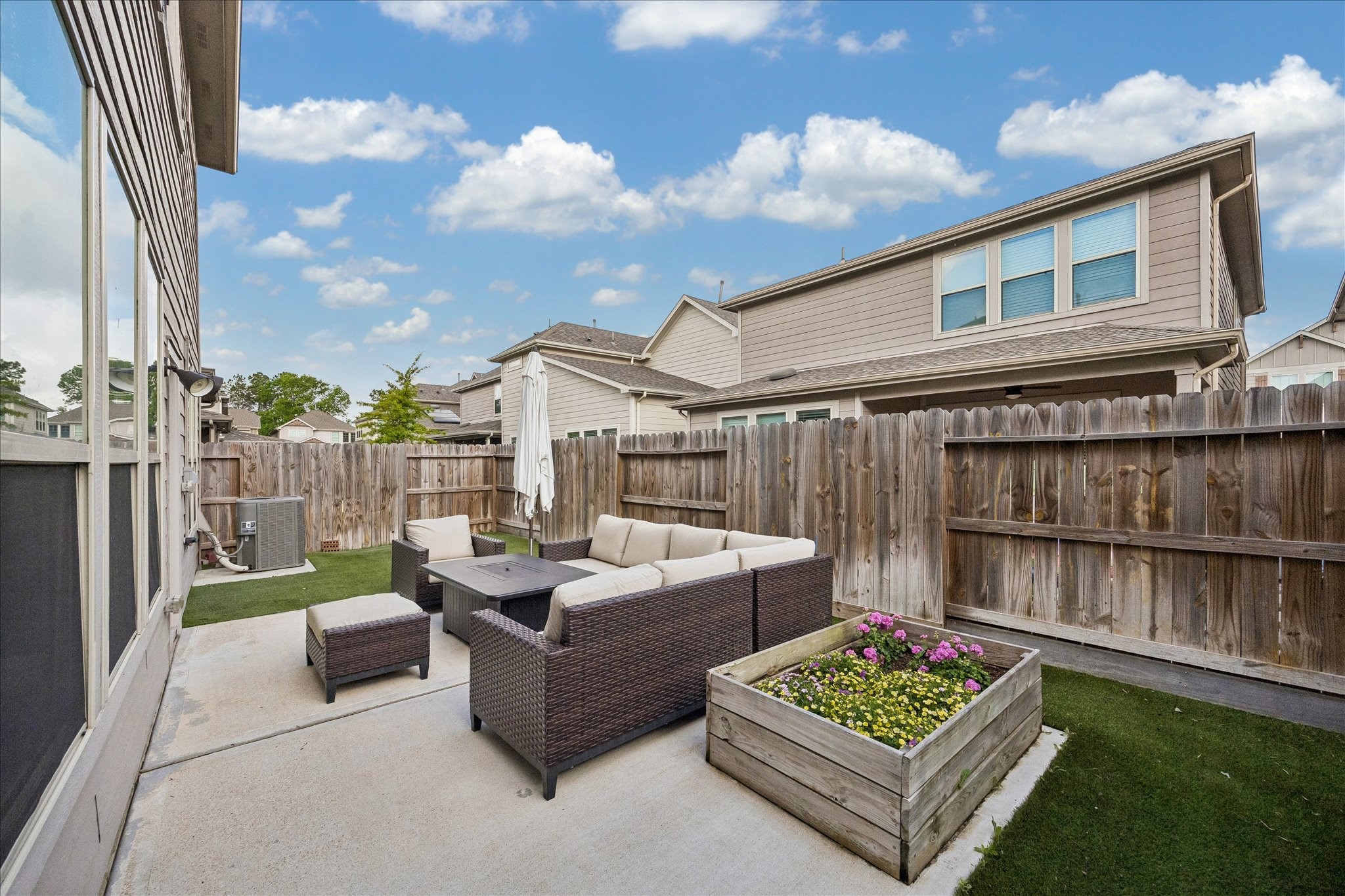 4026 Delta Rose Street Houston, TX 77018 - Photo 32 of 44 Fenced backyard with patio seating offers a low maintenance outdoor space for relaxing and entertaining.