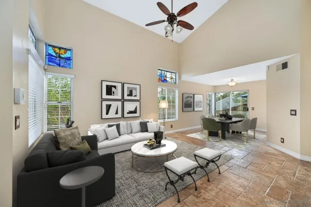 a living room with furniture and a large window
