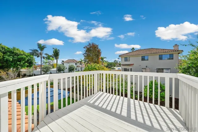 a view of a two chairs on the roof deck