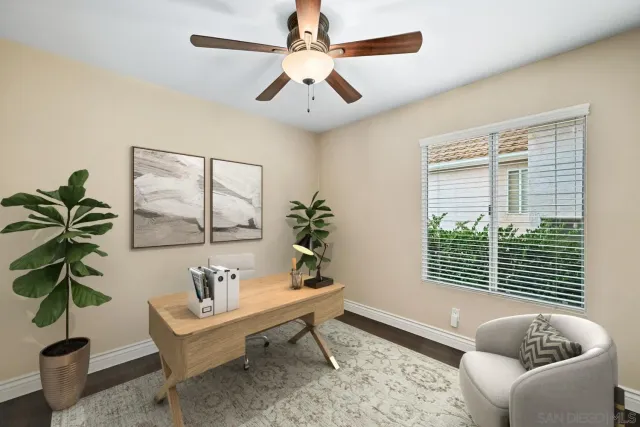 a living room with furniture lamp and window