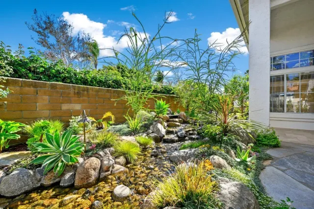 a view of a garden with a fountain