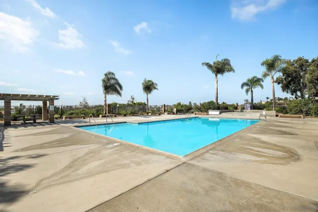 a view of a swimming pool and an outdoor space
