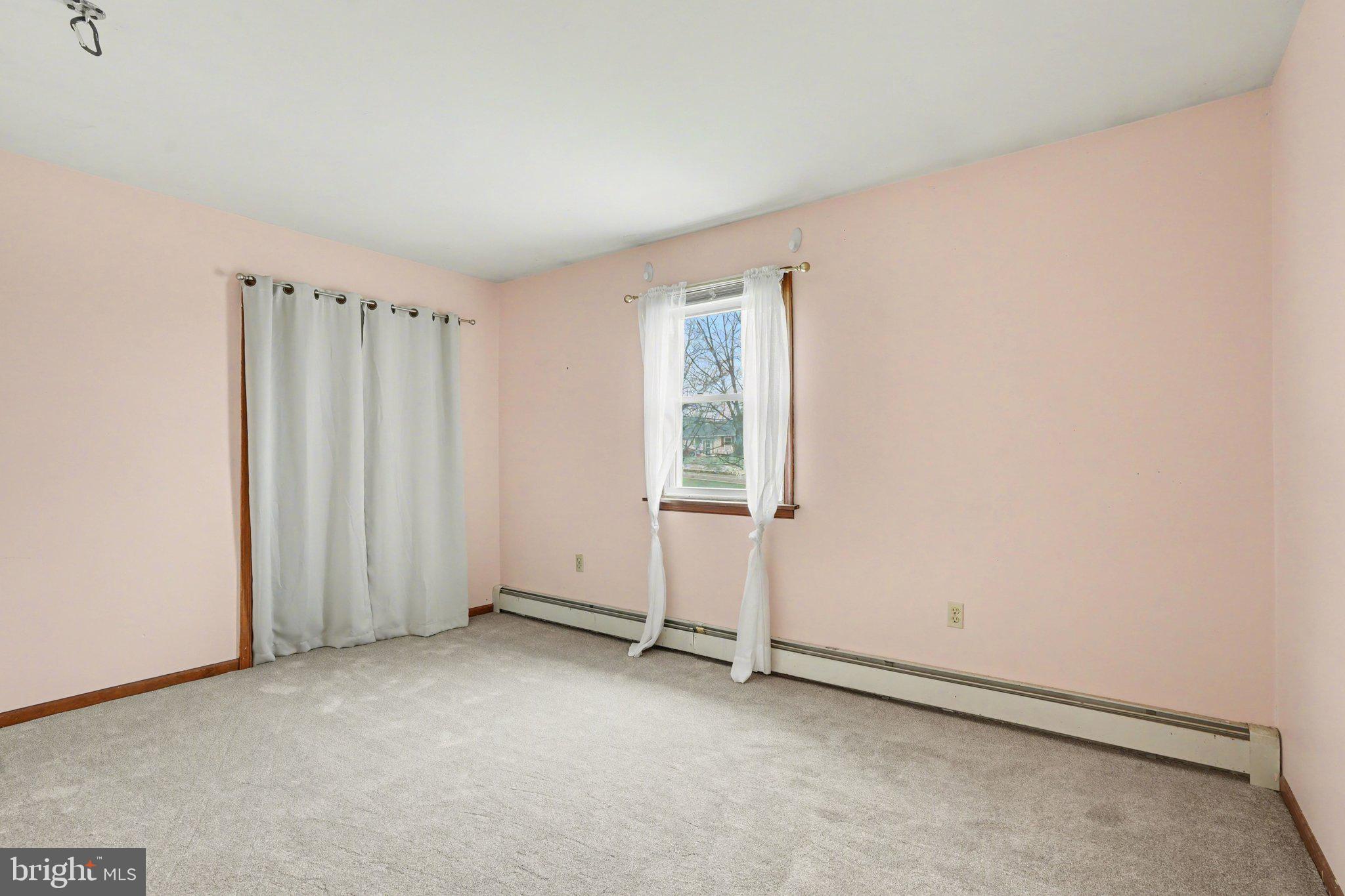 711 West Siddonsburg Road Dillsburg, PA 17019 - Photo 11 of 26 an empty room with a empty space and a window