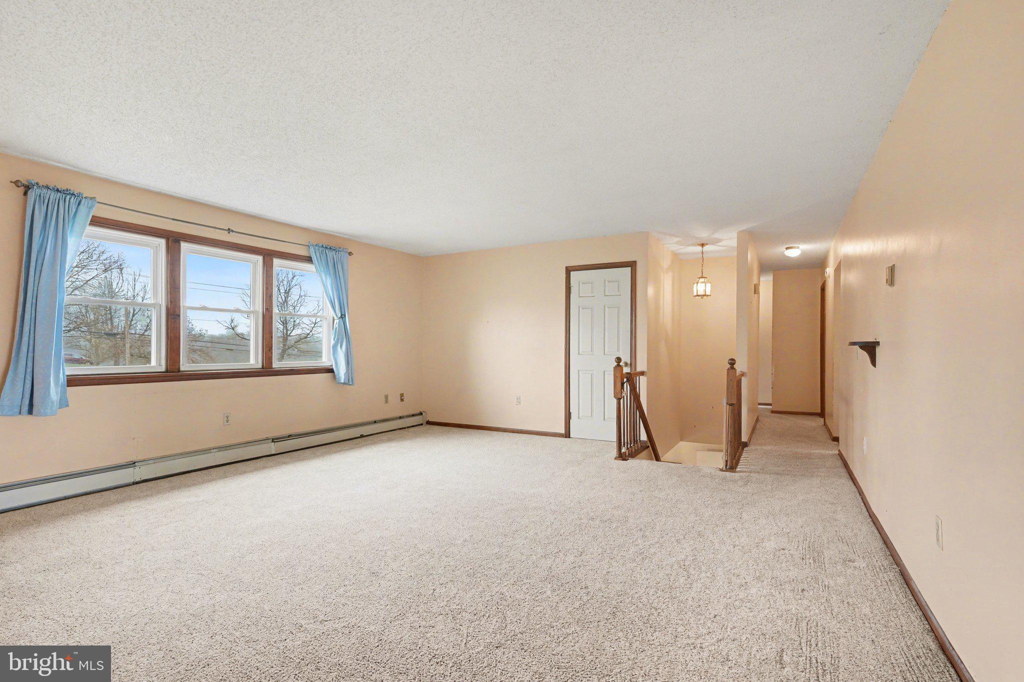 711 West Siddonsburg Road Dillsburg, PA 17019 - Photo 3 of 26 a view of an empty room with a window