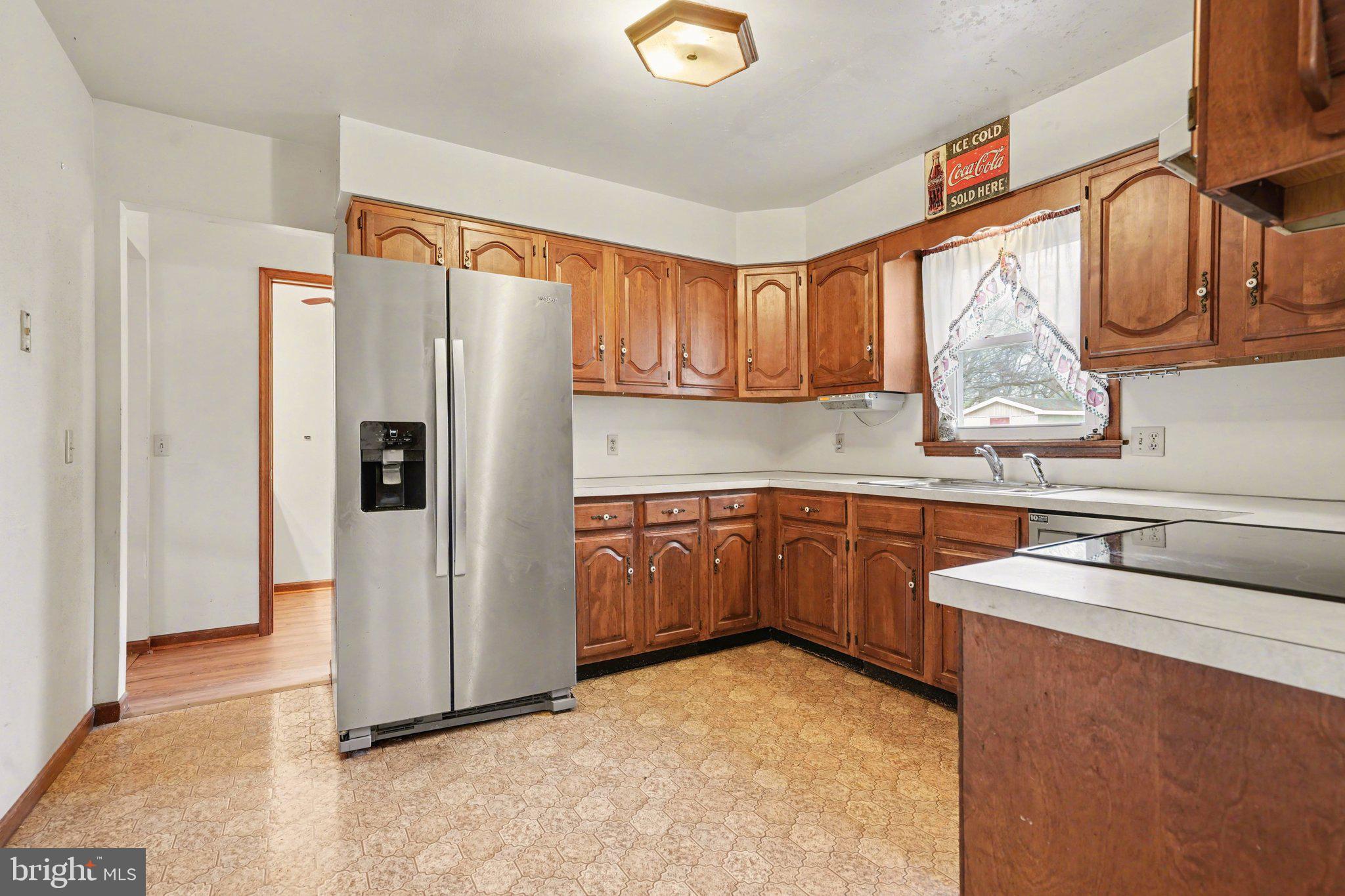711 West Siddonsburg Road Dillsburg, PA 17019 - Photo 7 of 26 a kitchen with stainless steel appliances granite countertop a refrigerator a sink and dishwasher