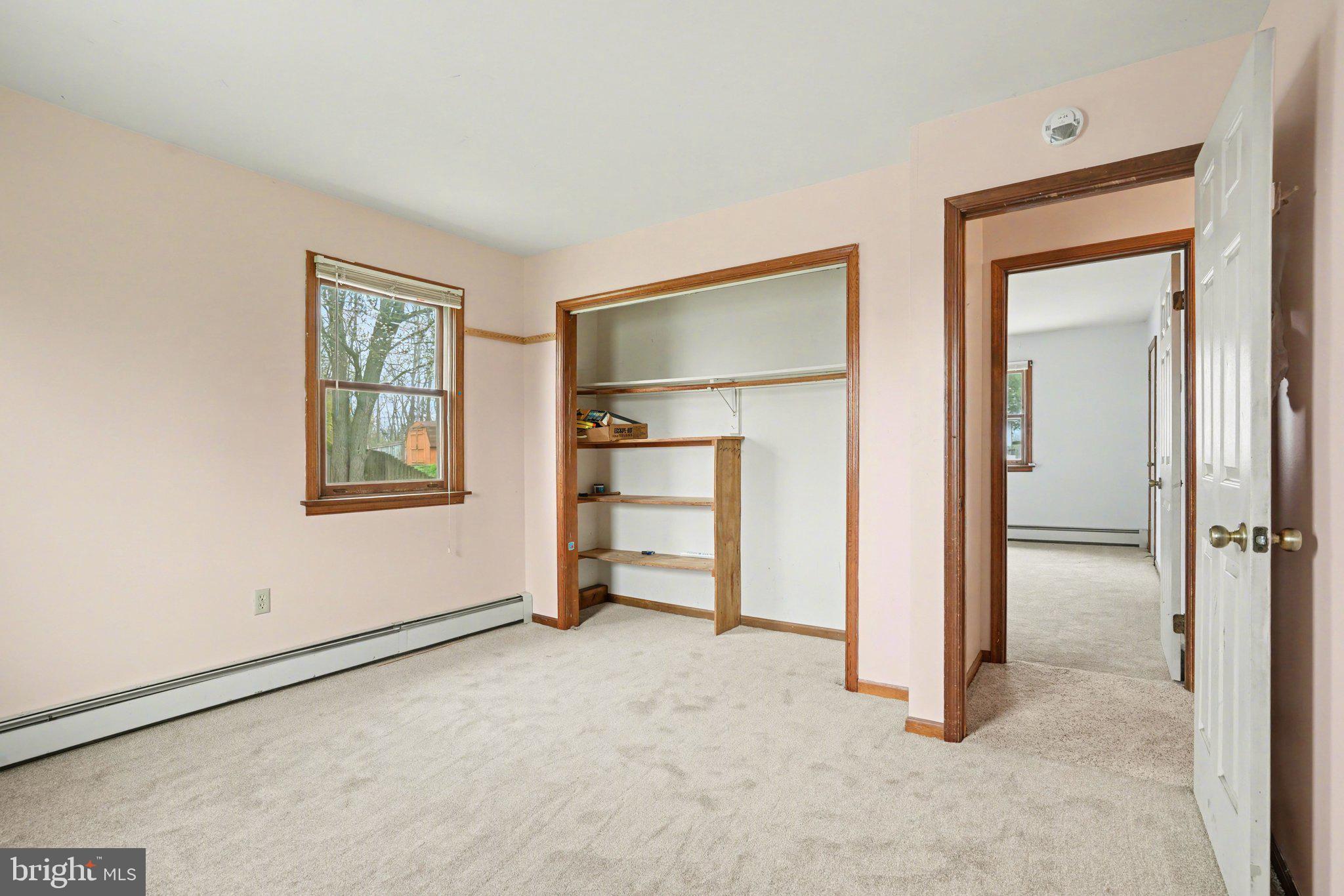 711 West Siddonsburg Road Dillsburg, PA 17019 - Photo 10 of 26 an empty room with a door and a bathroom