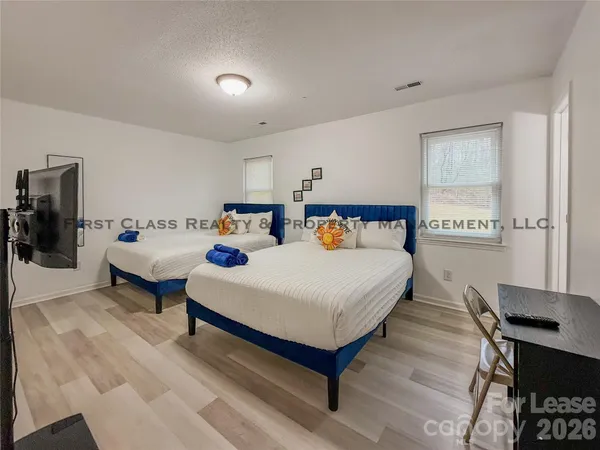 a bed room with a bed and a table