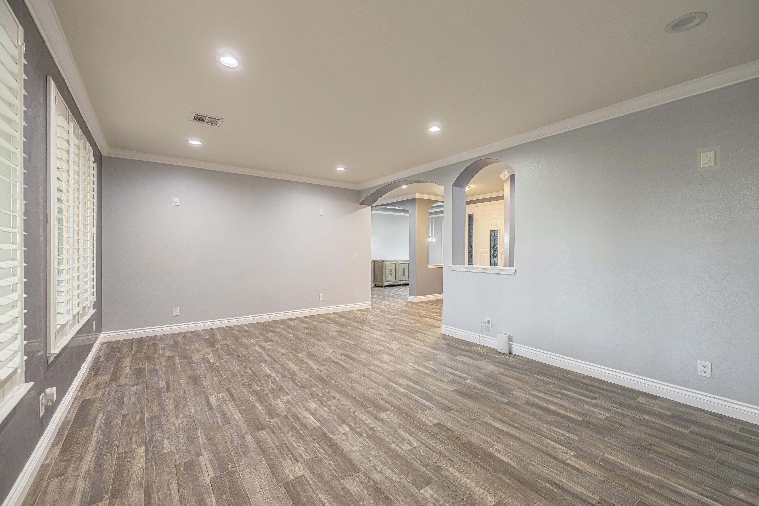 4023 Derby Circle Lancaster, CA 93536 - Photo 11 of 53 wooden floor in an empty room with a window