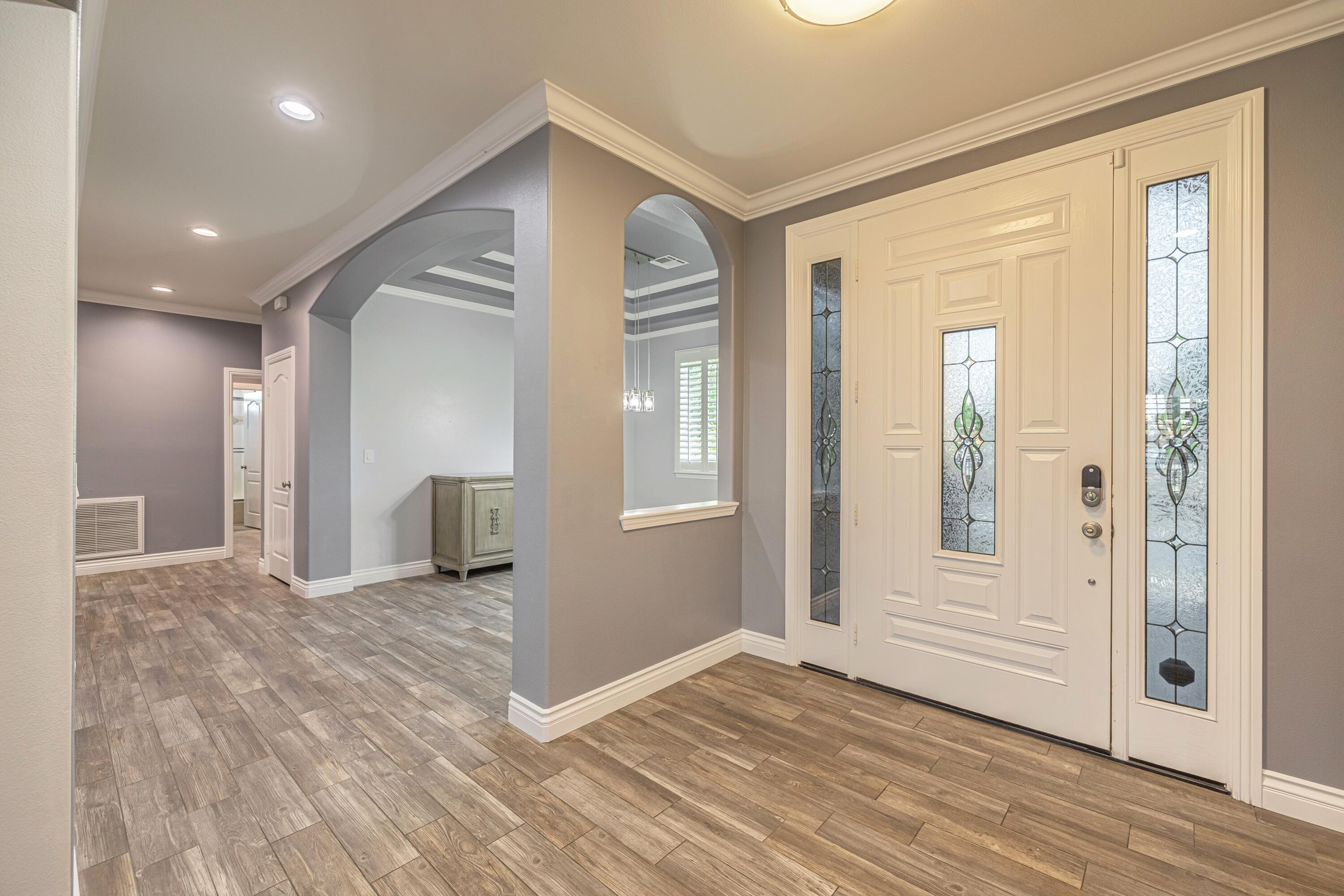 4023 Derby Circle Lancaster, CA 93536 - Photo 13 of 53 a view of a livingroom with wooden floor and a bathroom