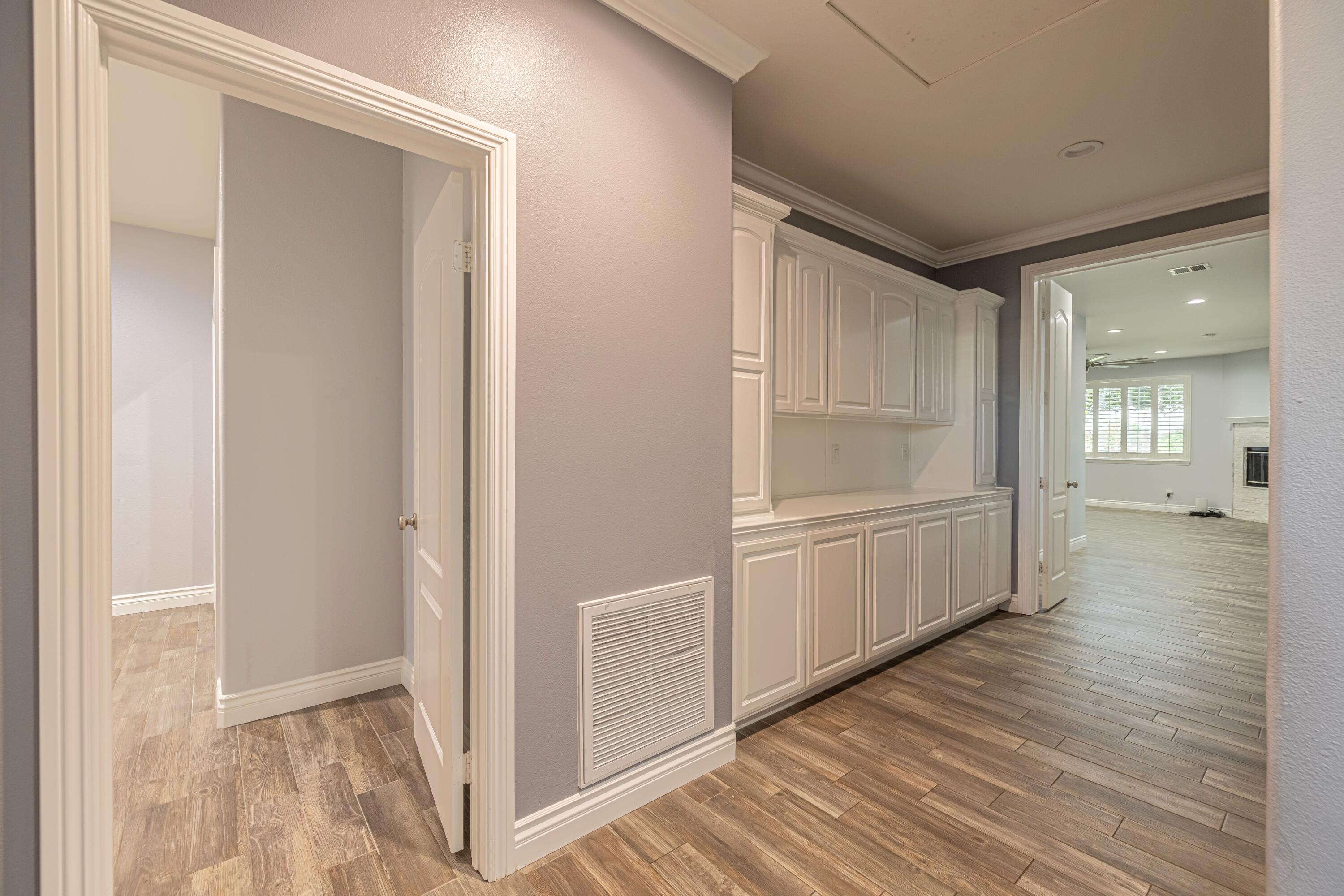 4023 Derby Circle Lancaster, CA 93536 - Photo 14 of 53 a view of a hallway with wooden floor and closet area