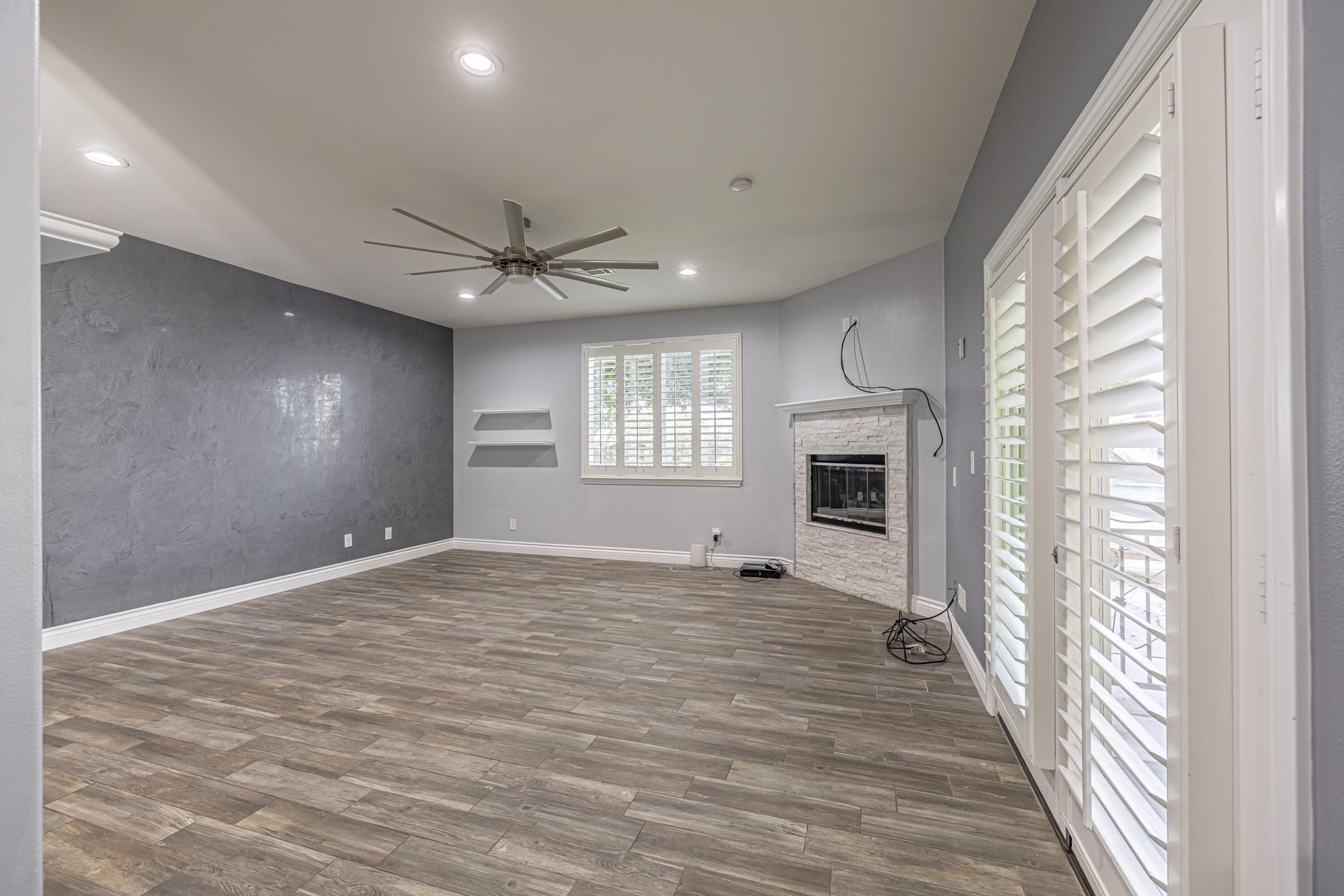 4023 Derby Circle Lancaster, CA 93536 - Photo 15 of 53 a view of a livingroom with a ceiling fan and window