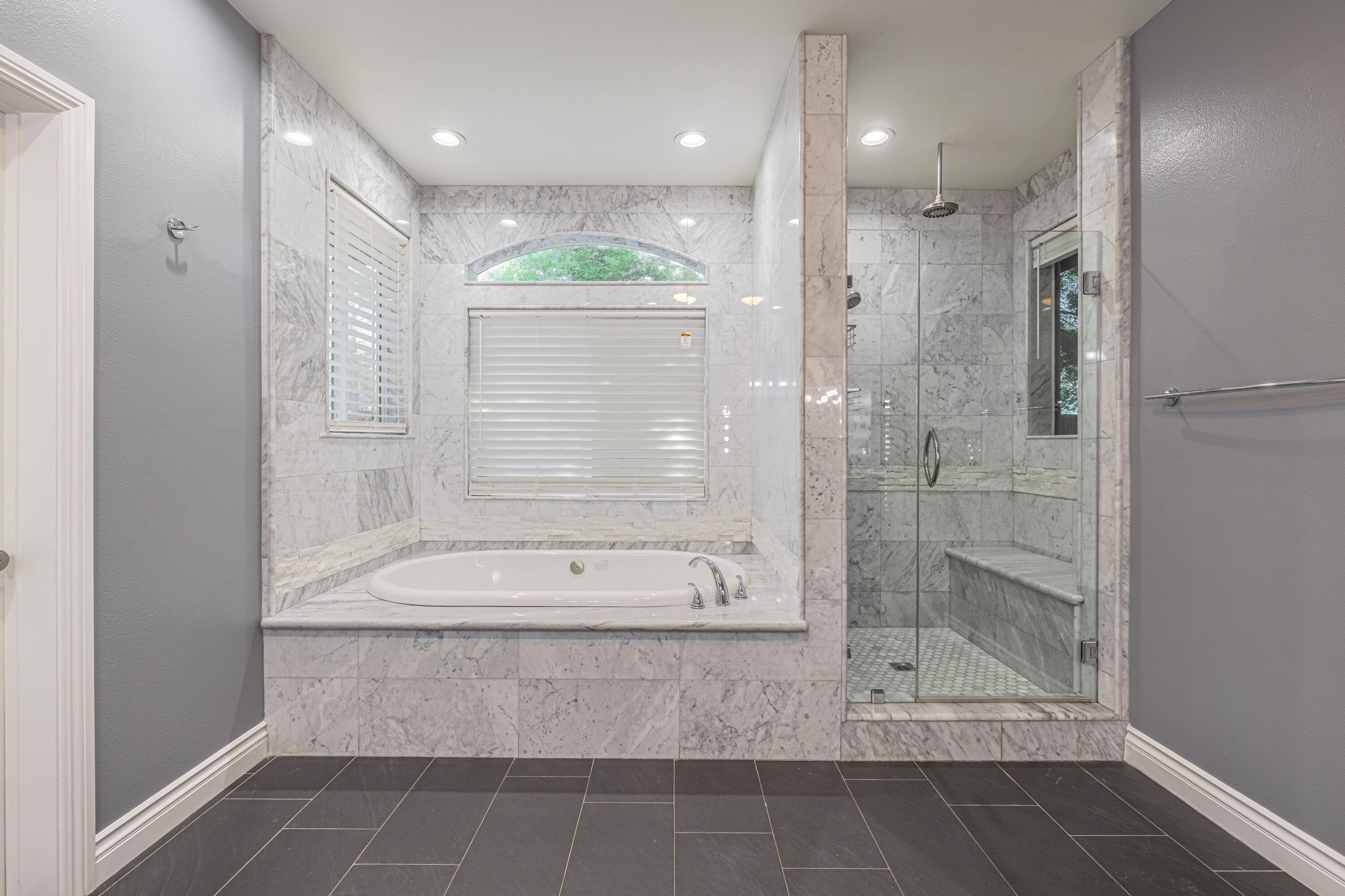 4023 Derby Circle Lancaster, CA 93536 - Photo 18 of 53 a bathroom with a bathtub and a shower