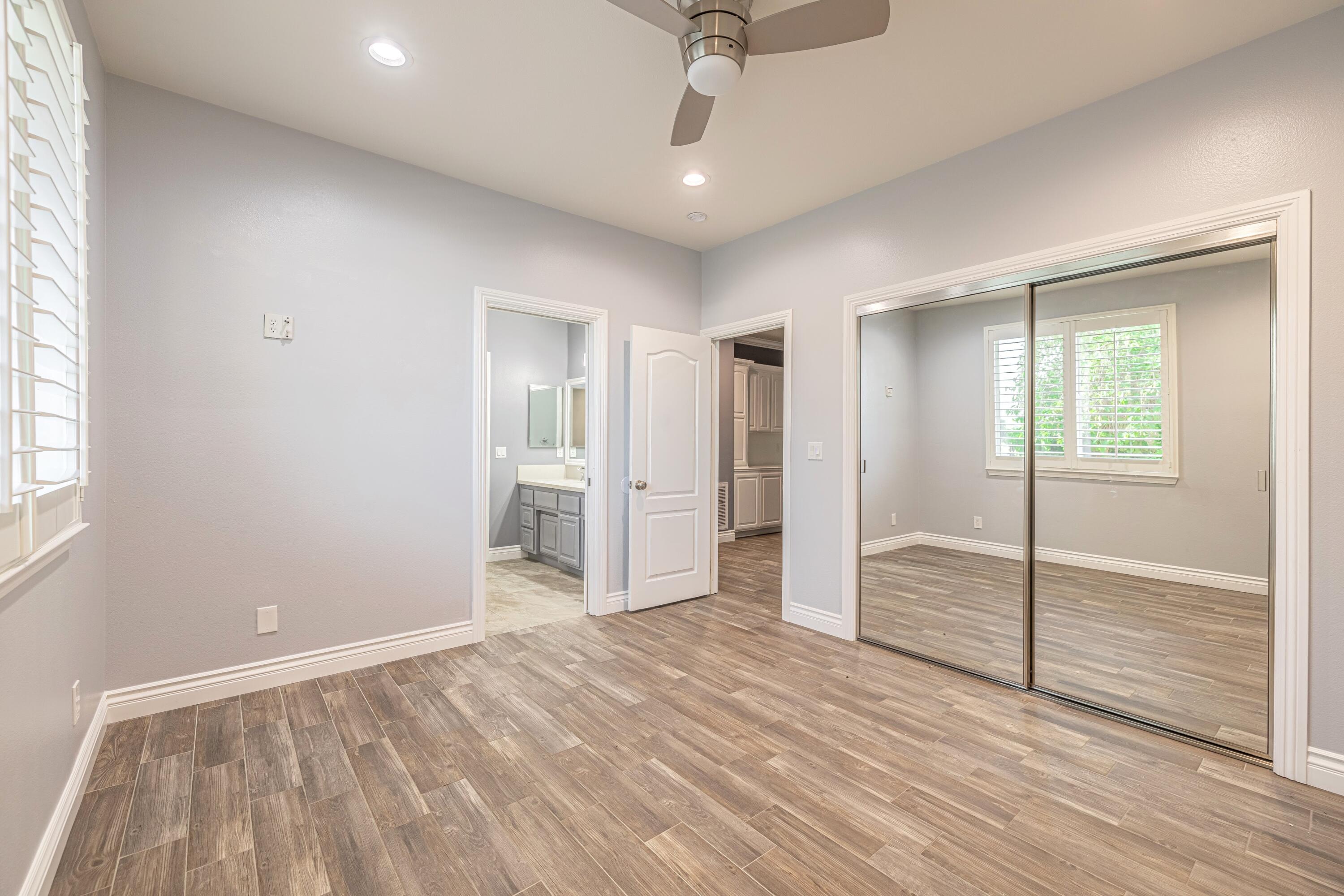 4023 Derby Circle Lancaster, CA 93536 - Photo 21 of 53 a view of empty room with wooden floor
