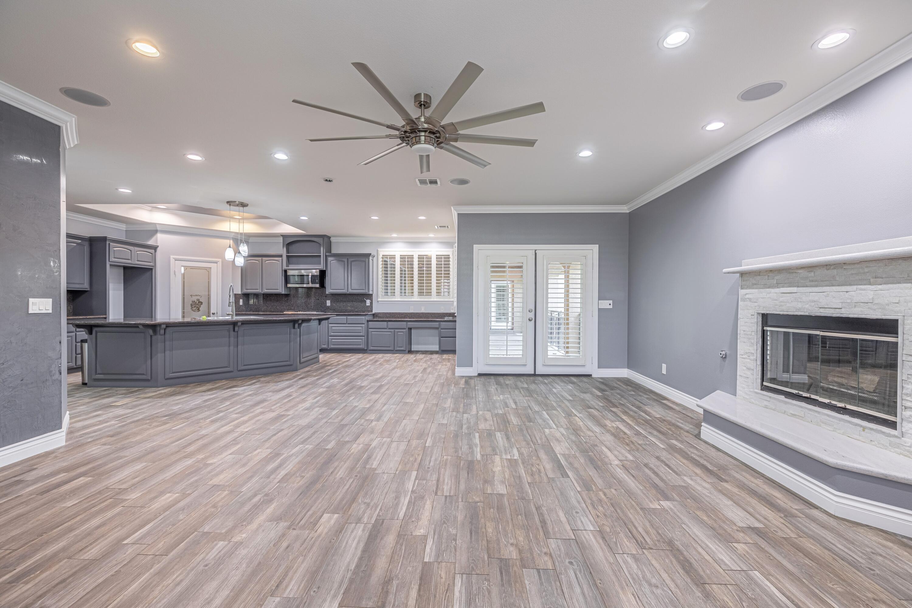 4023 Derby Circle Lancaster, CA 93536 - Photo 53 of 53 a view of a big room with wooden floor and a kitchen
