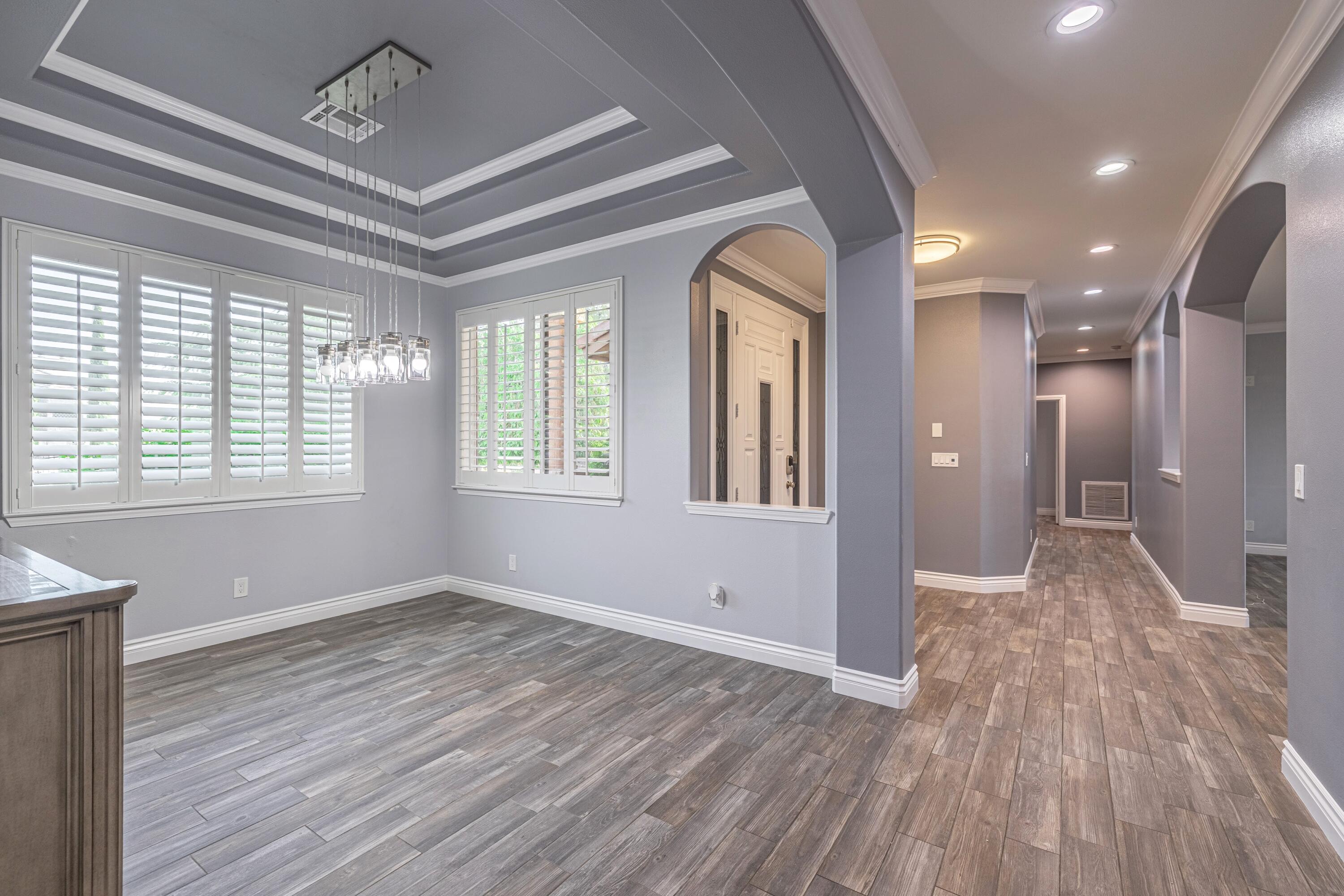 4023 Derby Circle Lancaster, CA 93536 - Photo 8 of 53 a view of livingroom with hardwood floor and hallway