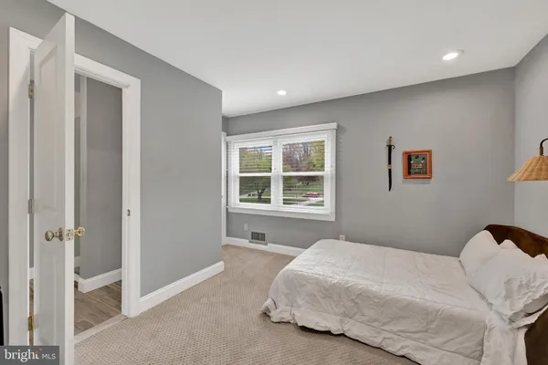 a view of a livingroom with furniture and a flat screen tv