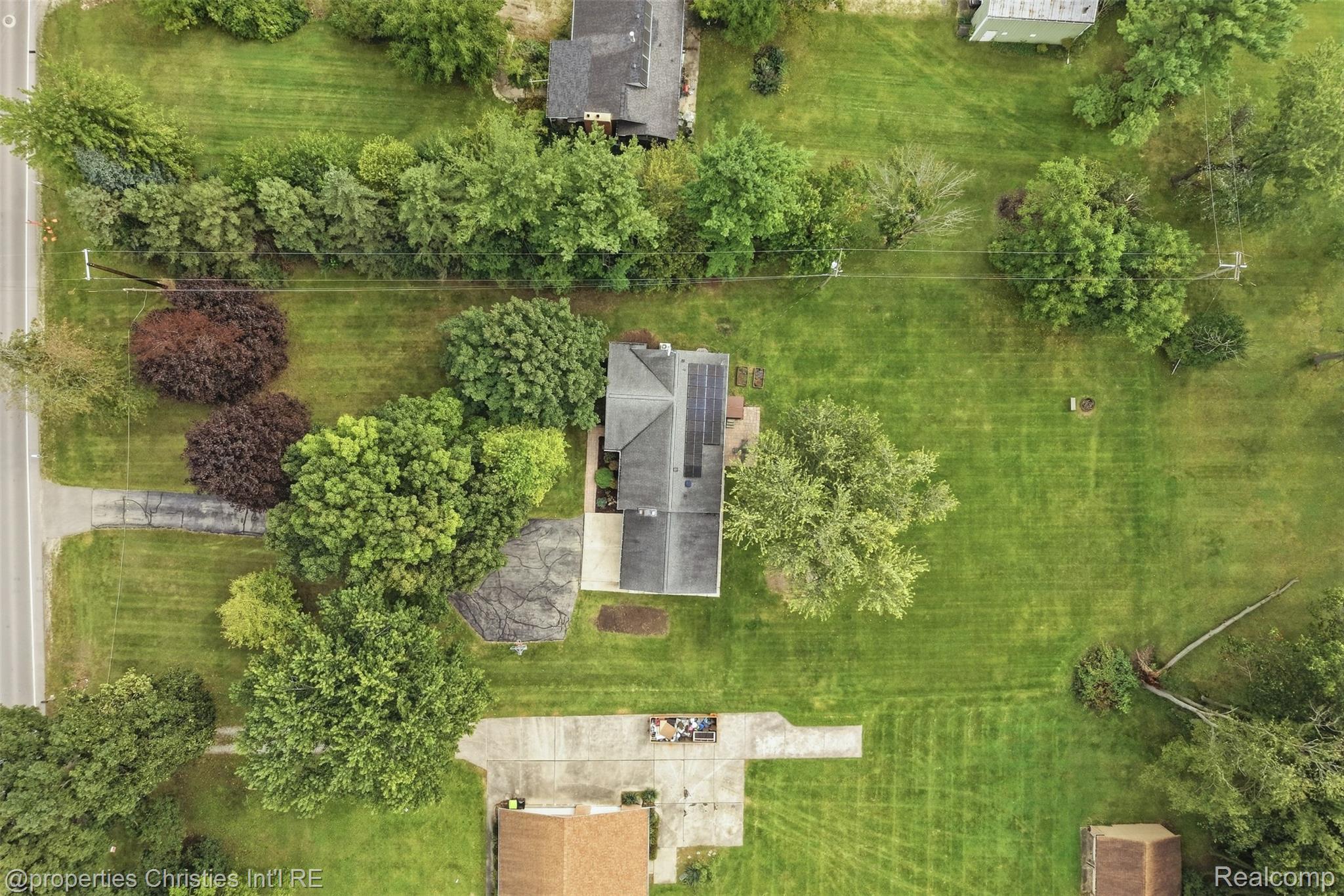 4030 Textile Road Ypsilanti, MI 48197 - Photo 49 of 58 Expansive green spaces with mature trees and paved driveways