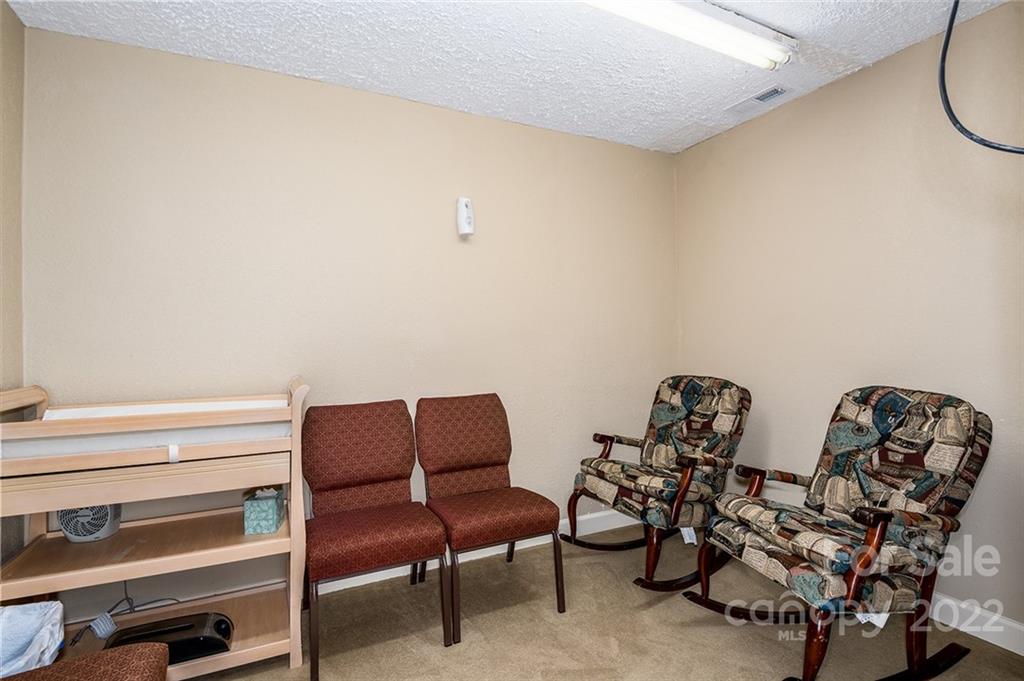 3521 Section House Road Hickory, NC 28601 - Photo 19 of 48 a couple of blue chairs sitting in a room next to a window