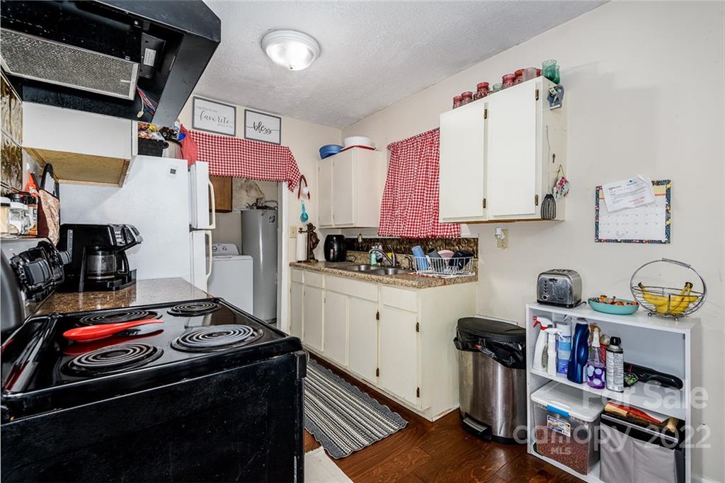 3521 Section House Road Hickory, NC 28601 - Photo 42 of 48 a kitchen with stainless steel appliances granite countertop a stove and a refrigerator