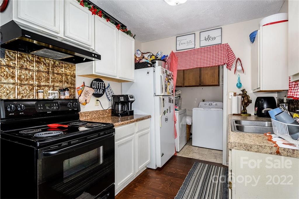 3521 Section House Road Hickory, NC 28601 - Photo 43 of 48 a kitchen with stainless steel appliances a stove a microwave and a refrigerator