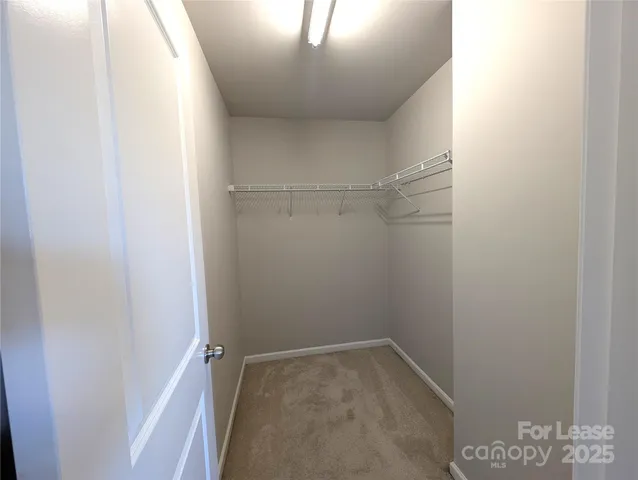 a bathroom with a sink a toilet a mirror a bathtub and shower