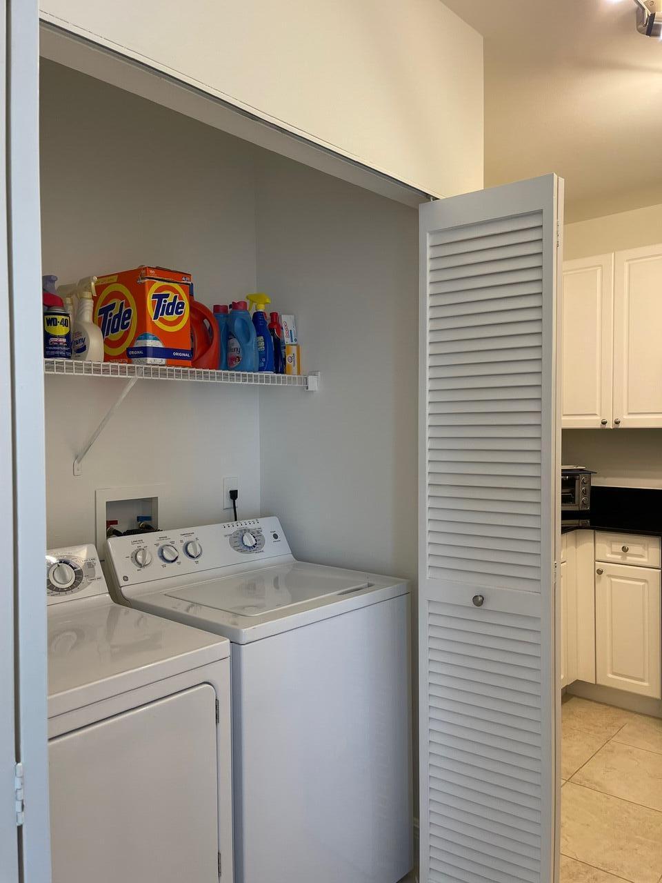 255 Evernia Street, Unit 407 West Palm Beach, FL 33401 - Photo 16 of 31 a utility room with dryer and washer