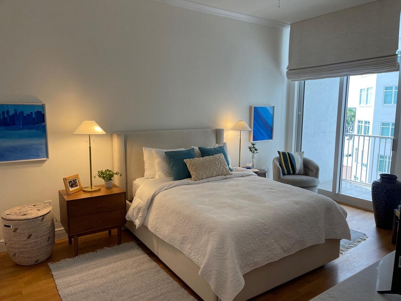 255 Evernia Street, Unit 407 West Palm Beach, FL 33401 - Photo 17 of 31 a bedroom with a bed and large windows