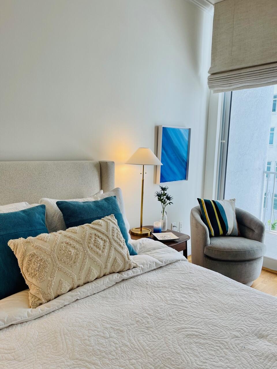 255 Evernia Street, Unit 407 West Palm Beach, FL 33401 - Photo 18 of 31 a bedroom with a bed and a couch