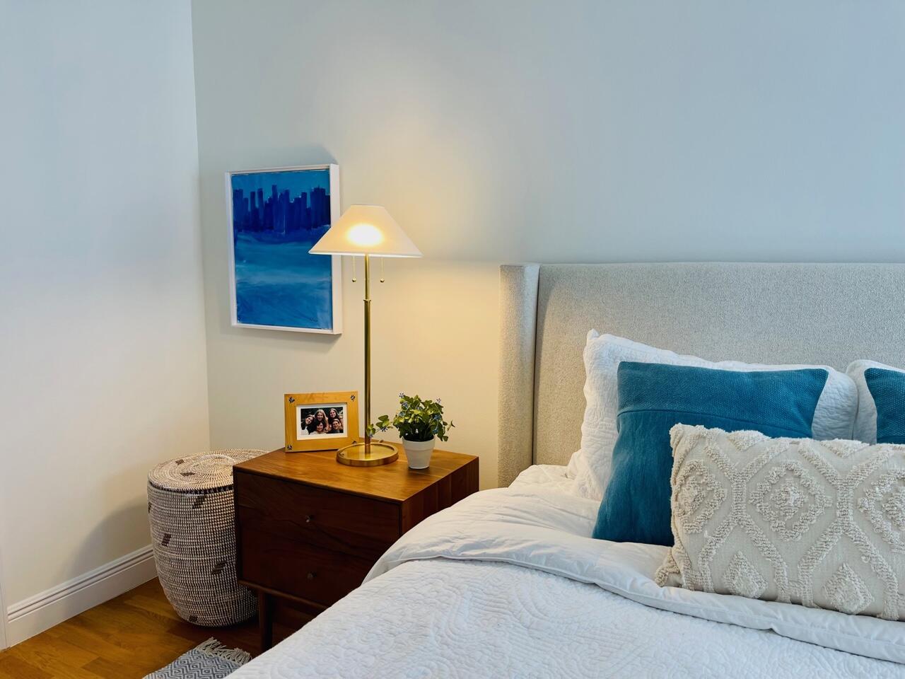 255 Evernia Street, Unit 407 West Palm Beach, FL 33401 - Photo 19 of 31 a bedroom with a bed and wooden floor