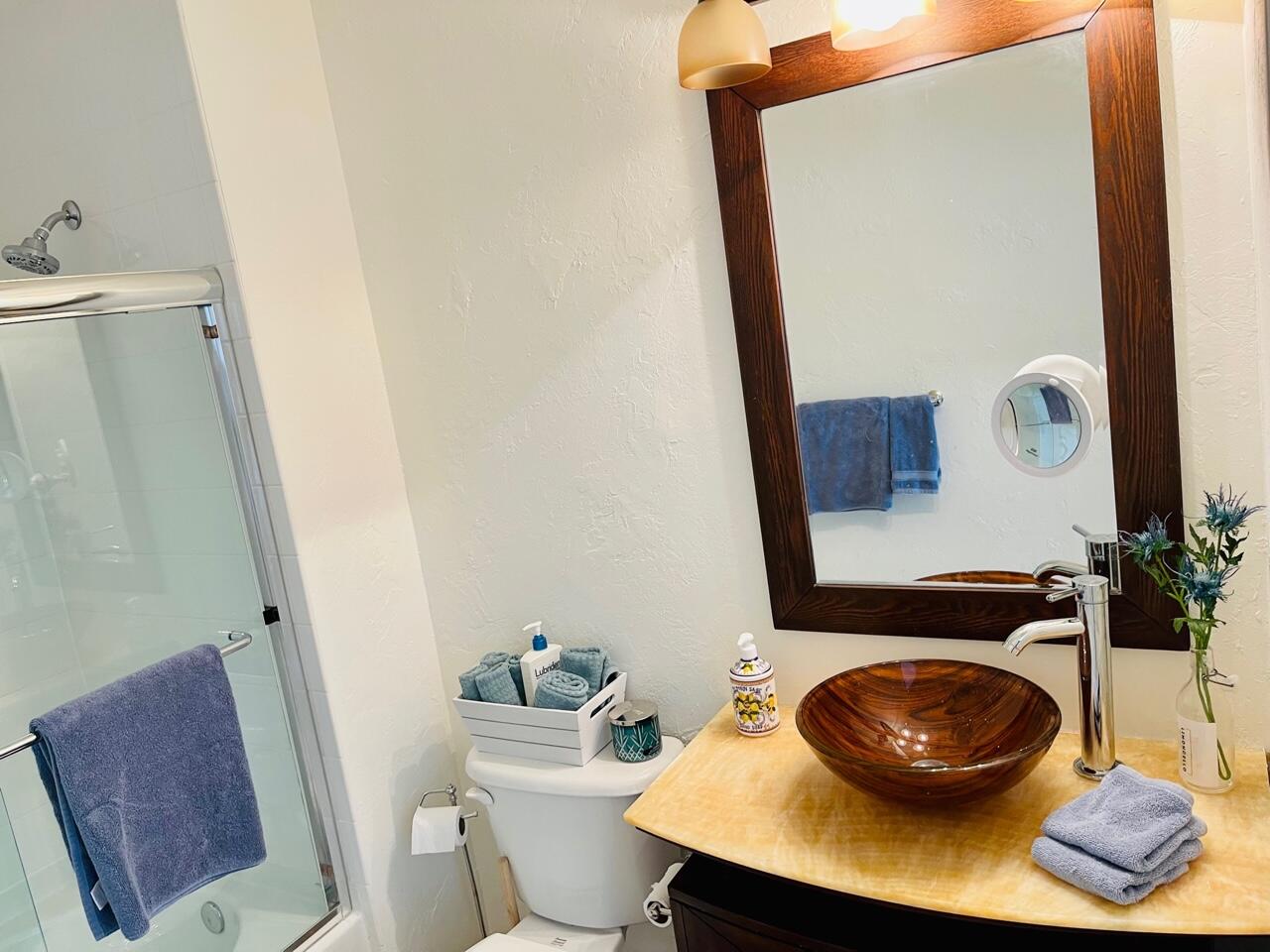 255 Evernia Street, Unit 407 West Palm Beach, FL 33401 - Photo 20 of 31 a bathroom with a sink a toilet and a mirror