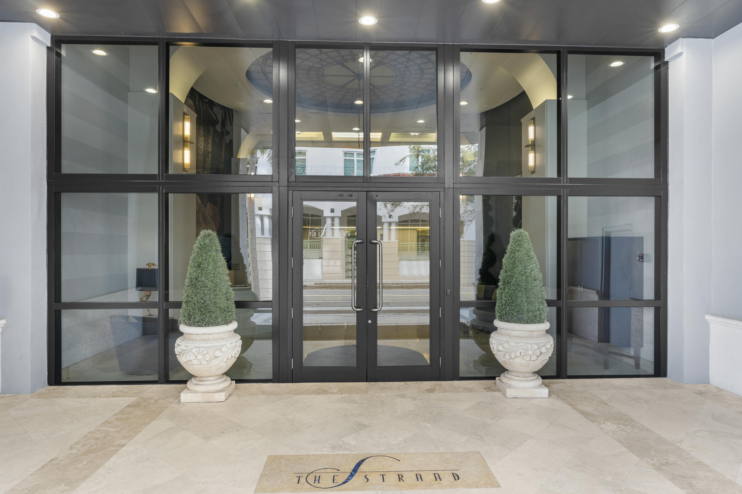 255 Evernia Street, Unit 407 West Palm Beach, FL 33401 - Photo 2 of 31 a view of a glass door of the house