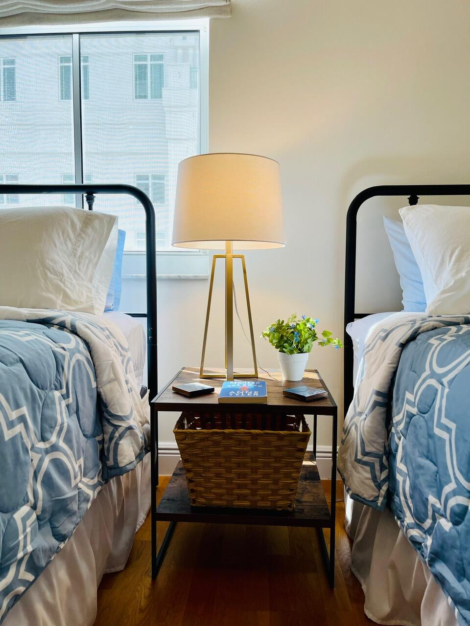 255 Evernia Street, Unit 407 West Palm Beach, FL 33401 - Photo 25 of 31 a bedroom with a bed and a lamp